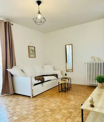 Coin salon dans l'établissement Cosy flat with view