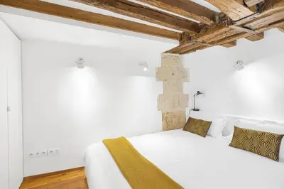 Un ou plusieurs lits dans un hébergement de l'établissement Petit Chalet
