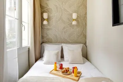 Un ou plusieurs lits dans un hébergement de l'établissement TBS 304 - Charming studio in Paris