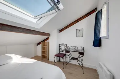 Un ou plusieurs lits dans un hébergement de l'établissement Large luxury Loft for 6 people by Weekome