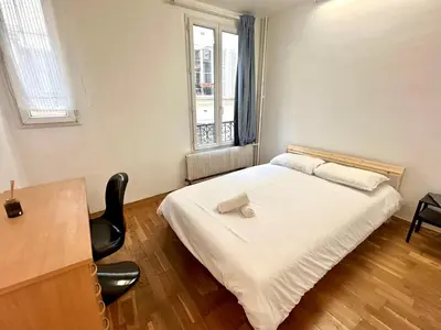 Un ou plusieurs lits dans un hébergement de l'établissement Bel appartement près de la Place de la République