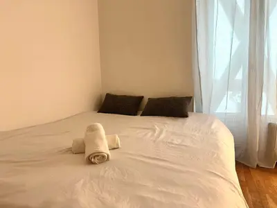 Un ou plusieurs lits dans un hébergement de l'établissement Bel appartement près de la Place de la République
