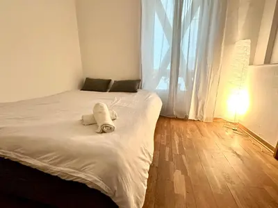 Un ou plusieurs lits dans un hébergement de l'établissement Bel appartement près de la Place de la République