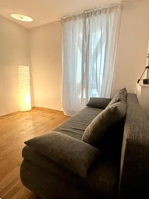 Coin salon dans l'établissement Bel appartement près de la Place de la République
