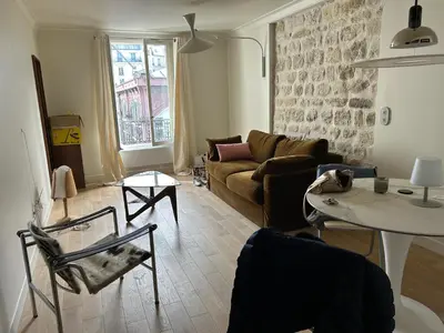 Coin salon dans l'établissement Appartement standing au cœur du 11 ème arrondissement de Paris