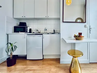 Cuisine ou kitchenette dans l'établissement Petit Paris