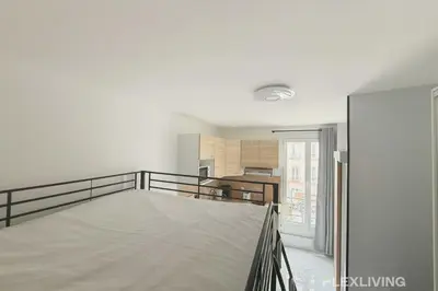 Un ou plusieurs lits dans un hébergement de l'établissement Flexliving - studio - Faubourg Saint-Antoine