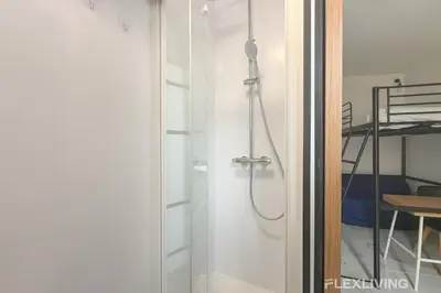 Un ou plusieurs lits superposés dans un hébergement de l'établissement Flexliving - studio - Faubourg Saint-Antoine
