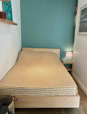 Un ou plusieurs lits dans un hébergement de l'établissement Cozy Studio Paris Montmartre