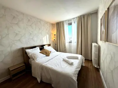 Un ou plusieurs lits dans un hébergement de l'établissement Nid douillet et convivial à Gambetta, Paris 20ème