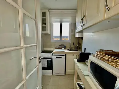 Cuisine ou kitchenette dans l'établissement Charmant Appartement 16eme