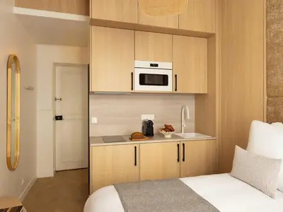 Cuisine ou kitchenette dans l'établissement Charming Cosy Studio - 2P - Gare Saint Lazare