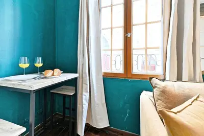 Coin salon dans l'établissement Cozy studio in the beautiful Marais