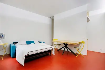 Un ou plusieurs lits dans un hébergement de l'établissement Studio Louvre Opera