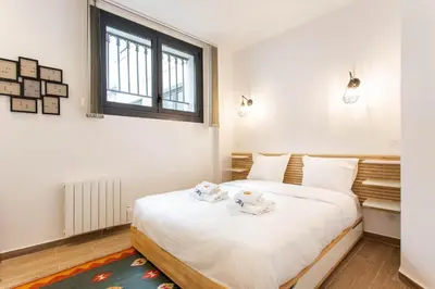 Un ou plusieurs lits dans un hébergement de l'établissement Amazing apartment - 2BR 6P - Aligre