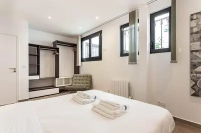 Un ou plusieurs lits dans un hébergement de l'établissement Amazing apartment - 2BR 6P - Aligre