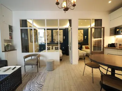 Un ou plusieurs lits dans un hébergement de l'établissement Saint Germain Elegant ChicSuites