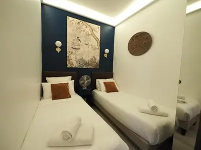 Un ou plusieurs lits dans un hébergement de l'établissement Saint Germain Elegant ChicSuites