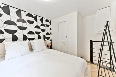 Un ou plusieurs lits dans un hébergement de l'établissement Maisonette 5 minutes from Paris - Levallois - II