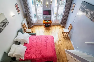 Un ou plusieurs lits dans un hébergement de l'établissement Paris Center Loft