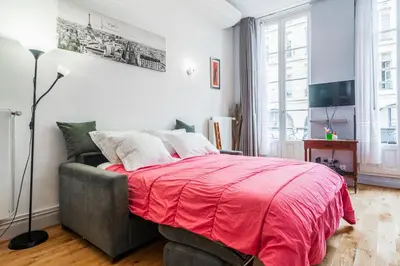 Un ou plusieurs lits dans un hébergement de l'établissement Paris Center Loft