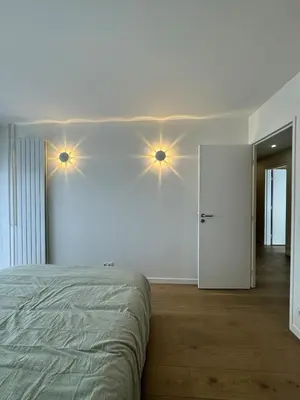Un ou plusieurs lits dans un hébergement de l'établissement appartement spacieux