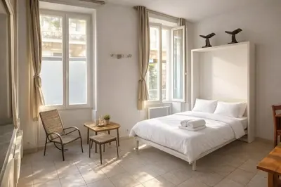 Un ou plusieurs lits dans un hébergement de l'établissement Le Passage Secret – Studio 4 pers à Paris