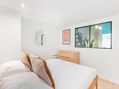 Un ou plusieurs lits dans un hébergement de l'établissement Cosy apartment - 1BR 4P - Passy Tour Eiffel