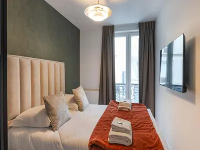 Un ou plusieurs lits dans un hébergement de l'établissement Magnificent apartment - 4BR 10P - Arc de Triomphe