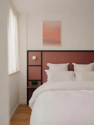Un ou plusieurs lits dans un hébergement de l'établissement Edgar Suites Hameau - Porte de Versailles