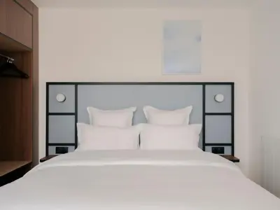 Un ou plusieurs lits dans un hébergement de l'établissement Edgar Suites Hameau - Porte de Versailles