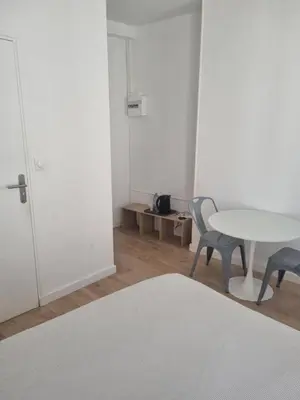 Un ou plusieurs lits dans un hébergement de l'établissement Chambre privée - Vue Tour Eiffel