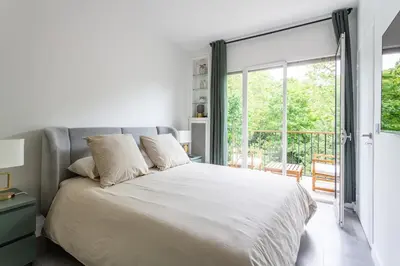 Un ou plusieurs lits dans un hébergement de l'établissement AV Experiences - Appartement Neuilly
