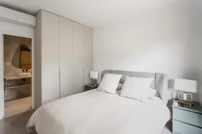 Un ou plusieurs lits dans un hébergement de l'établissement AV Experiences - Appartement Neuilly