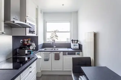Cuisine ou kitchenette dans l'établissement AV Experiences - Appartement Neuilly