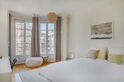 Un ou plusieurs lits dans un hébergement de l'établissement Paris Les Amandiers Residence