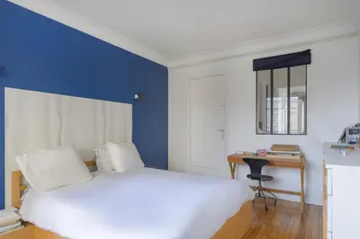 Un ou plusieurs lits dans un hébergement de l'établissement Paris Les Amandiers Residence