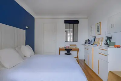 Un ou plusieurs lits dans un hébergement de l'établissement Paris Les Amandiers Residence