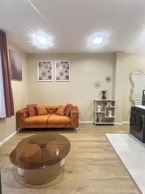 Coin salon dans l'établissement Le Nid de Clichy
