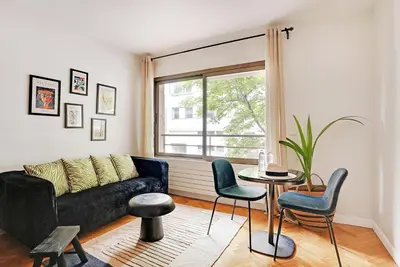 Coin salon dans l'établissement Charmant studio 30 m2 proche Hôpital américain