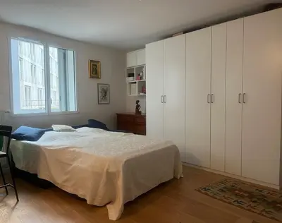 Un ou plusieurs lits dans un hébergement de l'établissement New cozy studio near Roland Garros and Parc des Princes