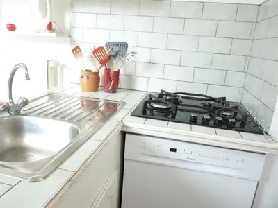 Cuisine ou kitchenette dans l'établissement Le Alesia