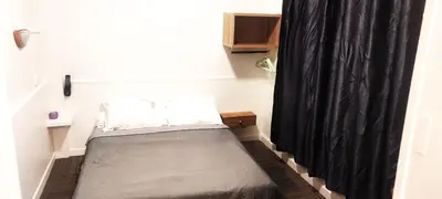 Un ou plusieurs lits dans un hébergement de l'établissement Hôtel Résidence Saint Ouen