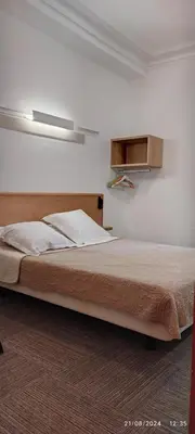 Un ou plusieurs lits dans un hébergement de l'établissement Hôtel Résidence Saint Ouen