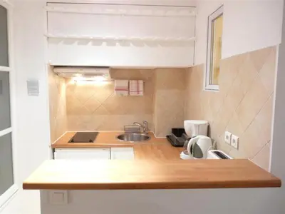 Cuisine ou kitchenette dans l'établissement Le Notre Dame