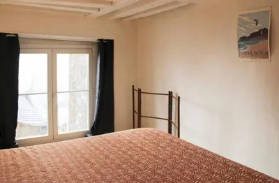 Un ou plusieurs lits dans un hébergement de l'établissement Duplex de charme au cœur du 2ème