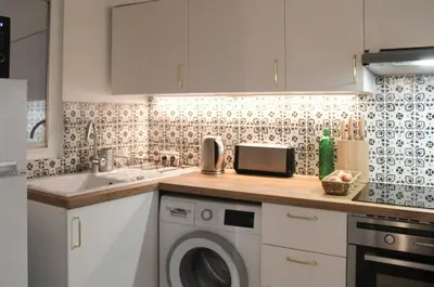 Cuisine ou kitchenette dans l'établissement Duplex de charme au cœur du 2ème