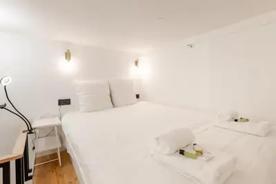Un ou plusieurs lits dans un hébergement de l'établissement Cosy Duplex in Central Paris