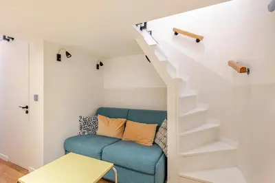 Coin salon dans l'établissement Cosy Duplex in Central Paris