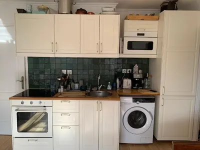 Cuisine ou kitchenette dans l'établissement Sunny escape in Belleville